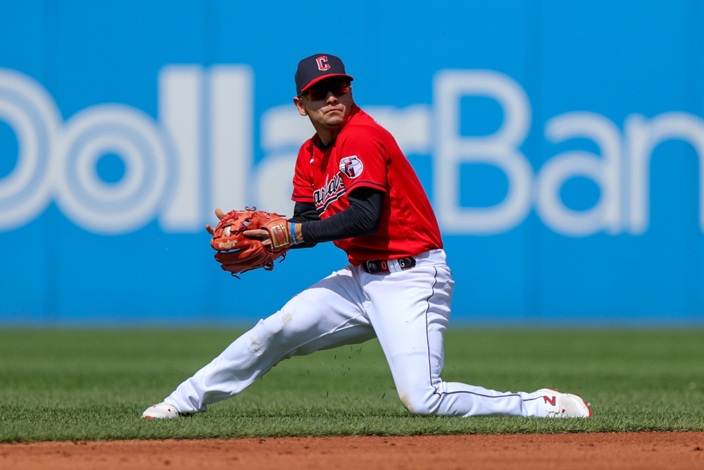 Andres Gimenez getting ready to throw the ball to first base after making a nice defensive play.