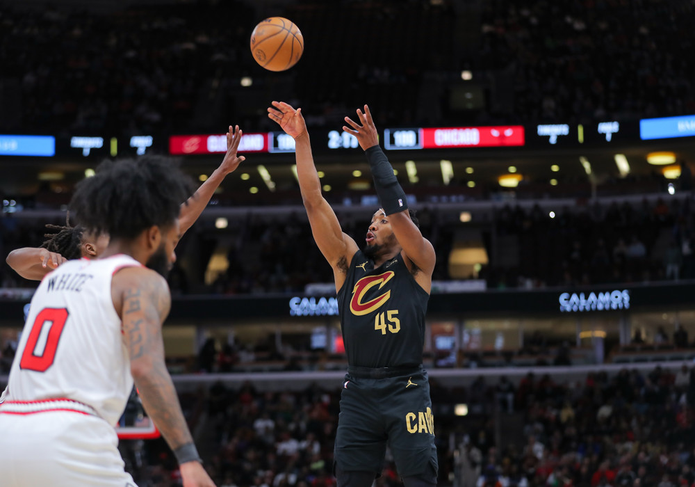 Cleveland's Donovan Mitchell shoots over a defender.