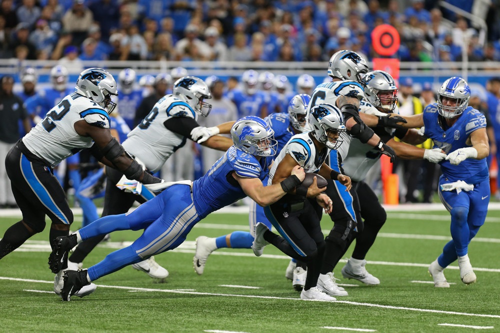 Aidan Hutchinson of the Lions sacks the Carolina quarterback