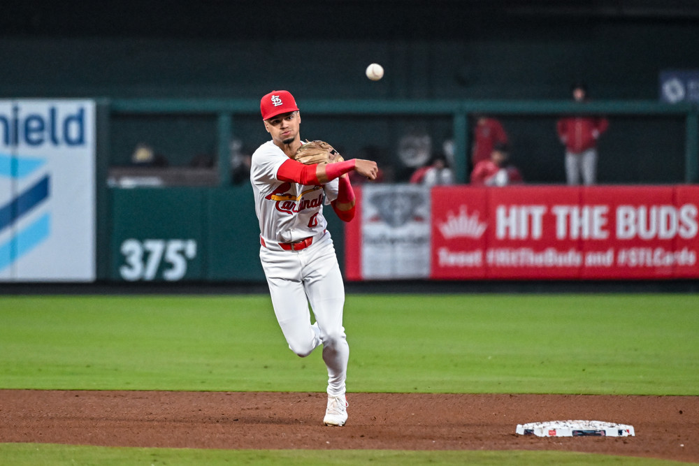 Shortstop Masyn Winn makes a throw to 1st base