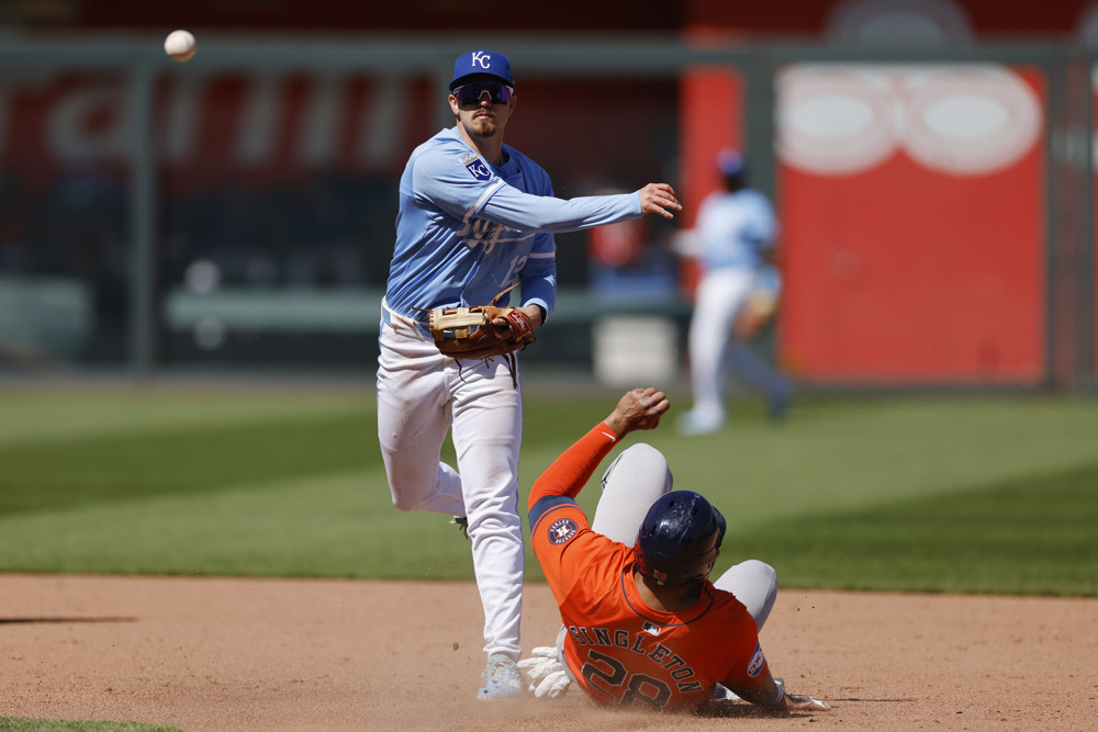 Nick Loftin throws a ball to 1st base to try to complete a double play.