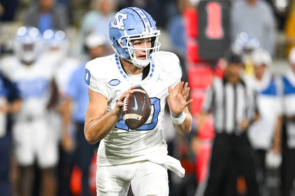 Drake Maye has the football in his right hand as he prepares to make a pass for North Carolina.