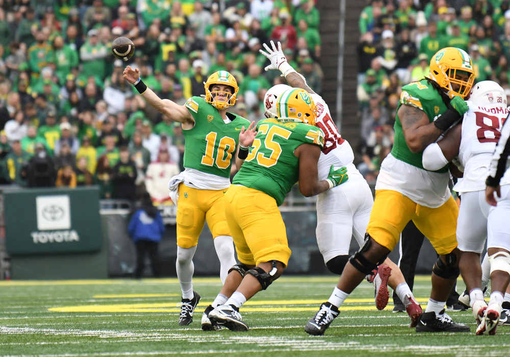 Bo Nix throws a pass in a game against Washington State.