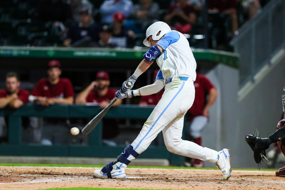 Vance Honeycutt makes contact on a swing at a low pitch