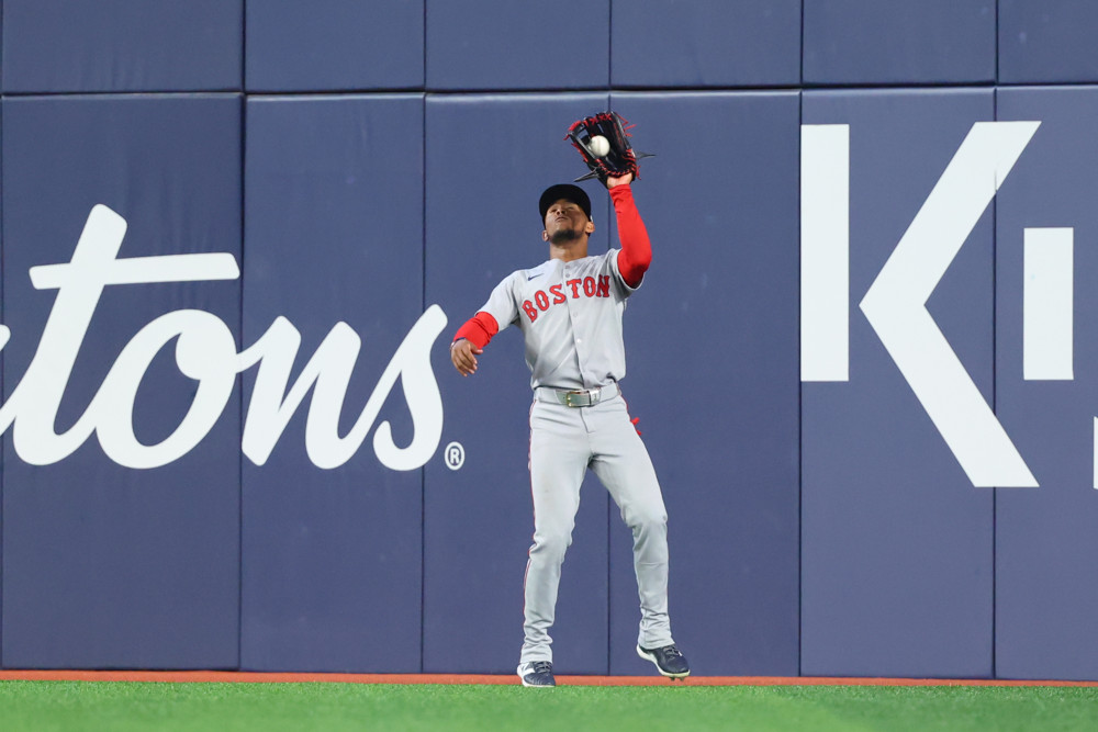Ceddanne Rafaela catches a fly ball in center field
